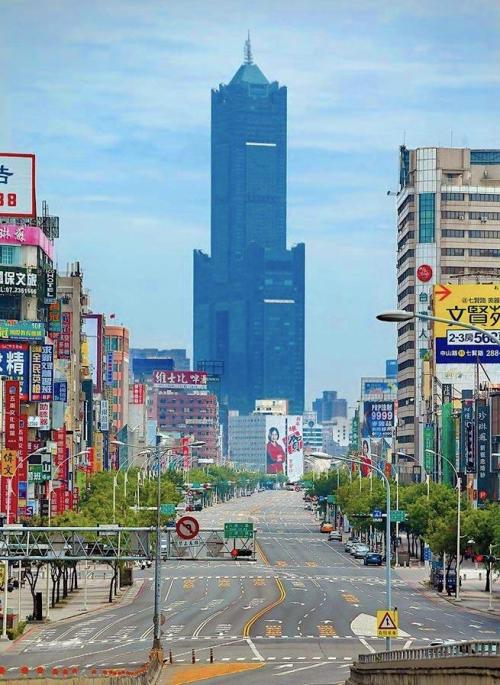 evilbuildingsblog:  Tuntex Sky Tower looming over the city of Kaohsiung, Taiwan, during an invasion drill