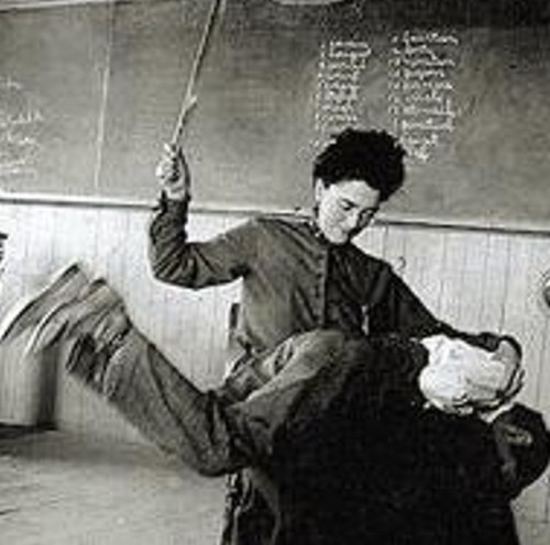 Old picture:Teacher spanking a pupil