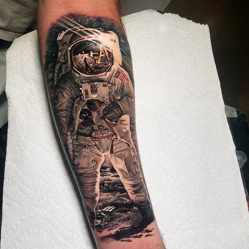 Colored Astronaut Tattoo On Left Forearm
