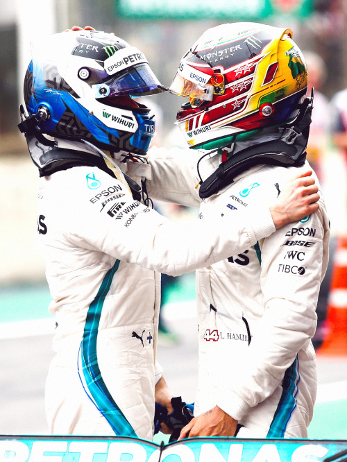 electric-arc:Lewis Hamilton celebrates with his team mate Valtteri Bottas after winning the F1 Brazi