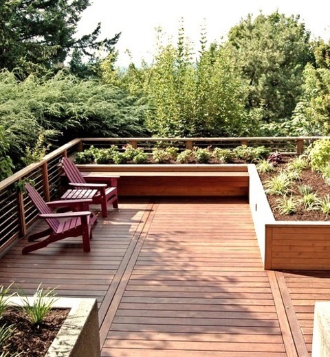 Mid-sized Modern Backyard Deck Design Featuring A PergolaDeck - Mid-sized Contemporary Backyard Deck