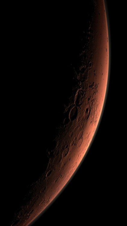 This computer-generated images depicts part of Mars at the boundary between darkness and daylight, w