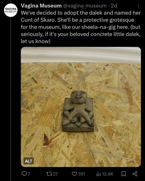 Another tweet from the Vagina Museum. It reads "We've decided to adopt the dalek and named her Cunt of Skaro. She'll be a protective grotesque for the museum, like our sheela-na-gig here. (but seriously, if it's your beloved concrete little dalek, let us know)." Attached is a photo of a small humanoid sculpture featuring a very prominent vagina.