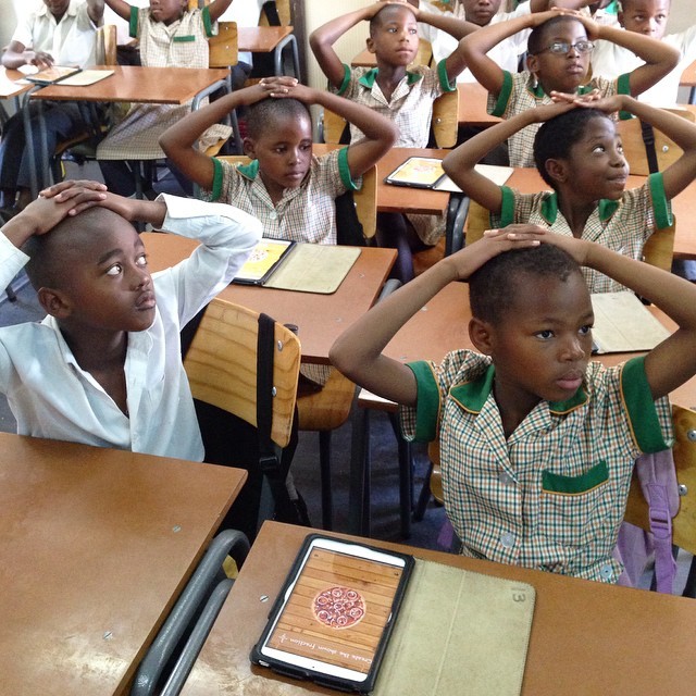 Children at Bovet Primary School in Alexandra, Johannesburg, await their teacher’s instruction at the start of a Grade 3 maths class. The children use iPad minis on a shared timetable system. This is the “hands-on-heads rule”, and it’s become a...