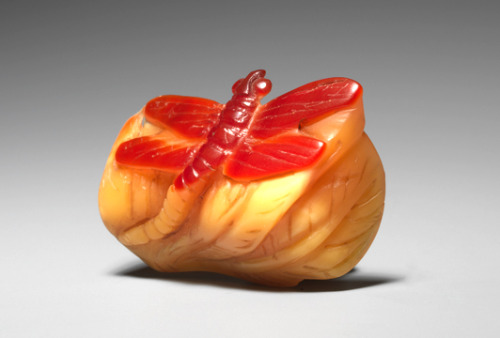 Attributed to Jugyoku Date: Circa 1850 A hoden (hornbill) netsuke of a resting dragonfly, the wings 