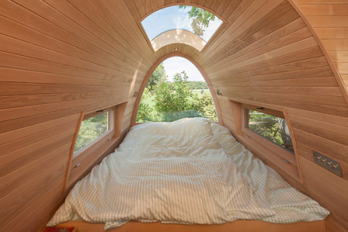 treehauslove:  Treehouse around the Oak. A modern treehouse built around an oak tree by a German architect Andreas Wenning. The treehouse was built 11 meters from the ground and offers some stunning views from the patio. Inside there’s a double bed