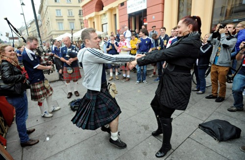 mondaymorningcenterback:A Scotland fan engages the locals on the streets of Warsaw.