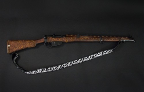 Maori carved Lee Enfield bolt action rifle.
