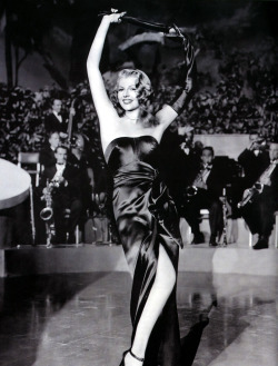 criterioncollection:  A dress so iconic, it has its own Wikipedia page.[Rita Hayworth in GILDA, 1946.]