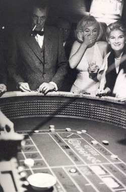 the60sbazaar:  John Huston and Marilyn Monroe at the casino (ph. Eve Arnold)