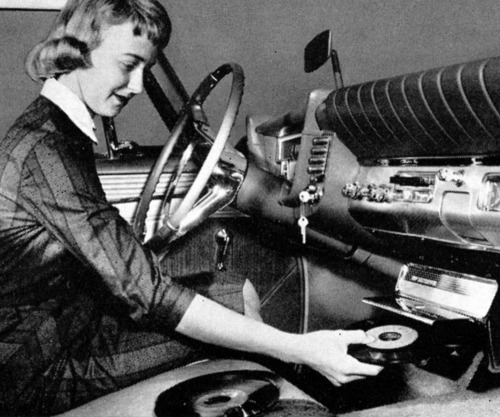 Vintage photographs of a time when cars had vinyl record players. See more here…