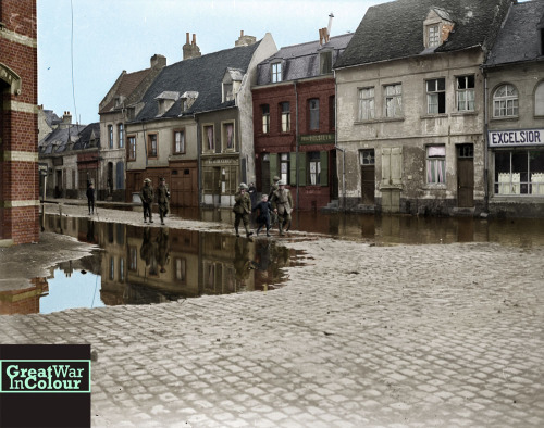 greatwarincolour:  A young girl leads Canadian soldiers down Rue de Rempart in Valenciennes, France 