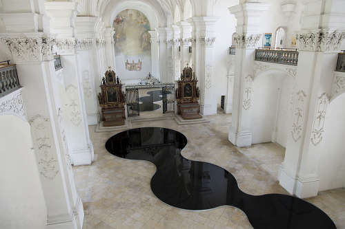 wetheurban: DESIGN: La Mise en Abîme Swiss artist Romain Crelier created this installation back in 2013 on the floor of the Bellelay Abbey, in Switzerland. Two shallow pools of used motor oil create the mirrors, reflecting the beauty of the buildings