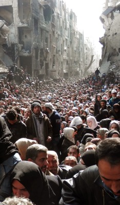 hijabby:  hawamisch:  fnhfal:  War in Syria   This isn’t just “War in Syria”. This is the mass exodus of people from Yarmouk, a Palestinian refugee camp in Damascus that has been under siege by the Assad government and military since 2013. Yarmouk,