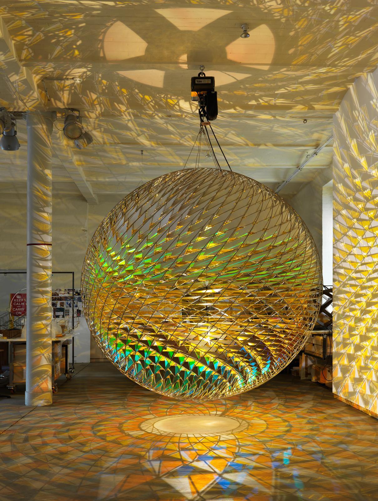 Olafur Eliasson (Danish-Icelandic, b. 1967, Copenhagen, Denmark) - Spherical Space, Studio Olafur Eliasson, 2015 Photo: Jens Ziehe Installation: Stainless Steel, Aluminium, Colored Glass (Yellow), Color-Effect Filter Glass (Orange), Halogen Bulb