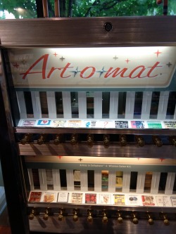 gokuma:  stayscrunchyeveninmilk:This is the coolest thing - a guy took a bunch of old cigarette vending machines and re-purposed them. Now you can buy tiny works of art from them! I got a lino print on a wood block, and an abstract painting of a flower.