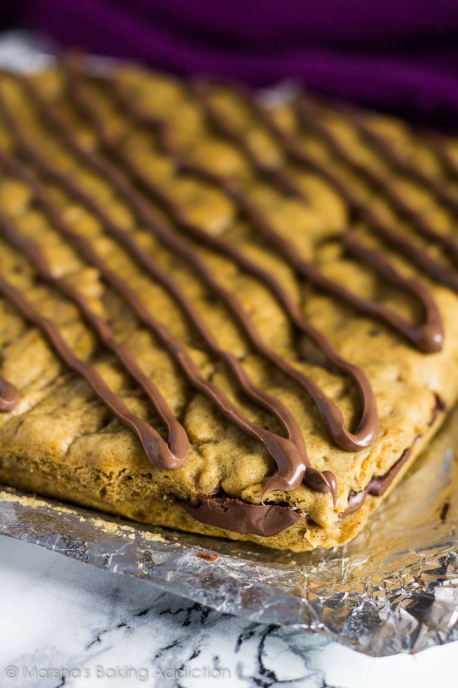 sweetoothgirl:  Nutella Stuffed Pumpkin Cookie Bars