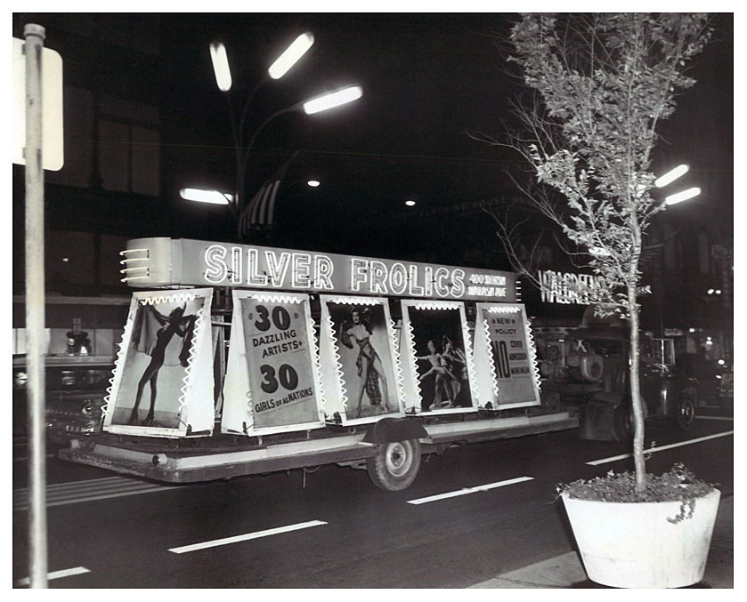 Vintage press photo dated from 1962 features a truck pulling an elaborate trailer