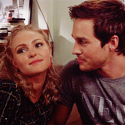 The way he looks at her .