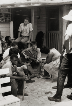 kvetchlandia:  Danny Lyon     Bob Dylan Joining Civil Rights Demonstrators Behind the Student Nonviolent Coordinating Committee (SNCC) Office, Greenwood, Mississippi     1963