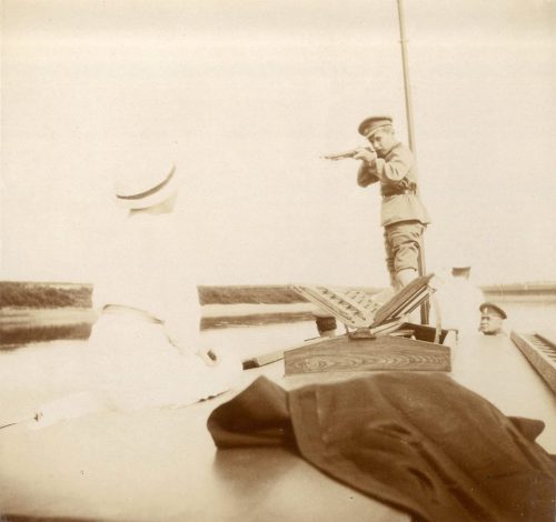  Tsarevich Alexei Nikolaevich Romanov pretending to “shoot” his sister Grand Duchess Tat