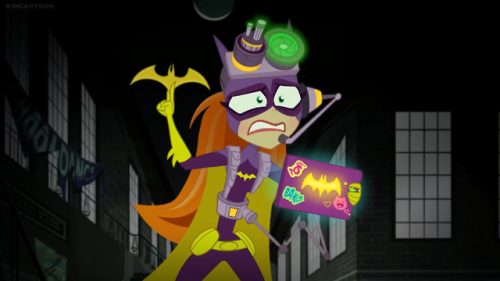 Fully equipped, Batgirl is searching the school for the “monster” and tracking everyone’s movement. 