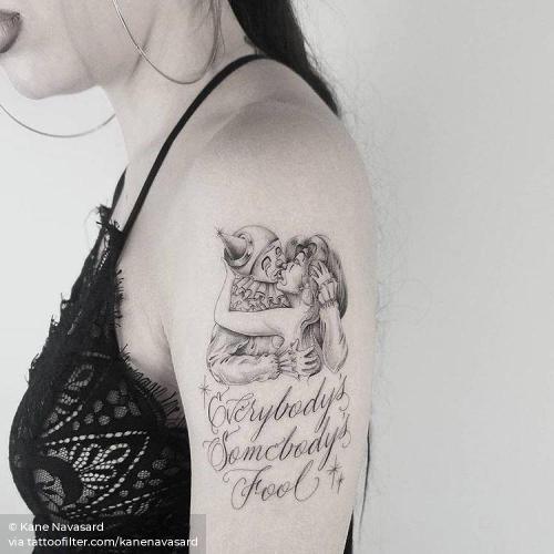 By Kane Navasard, done in Los Angeles. http://ttoo.co/p/35775 circus;clown;english tattoo quotes;english;everybody s somebody s fool;facebook;kanenavasard;kiss;languages;lovers;love;medium size;profession;single needle;quotes;twitter;upper arm