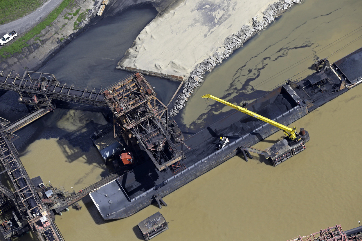 rocksandants:
“This aerial photo shows the United Bulk Terminals in Devant, Louisiana, on February 18, 2014. Three environmental groups claim in a federal lawsuit that the coal terminal, south of New Orleans, is polluting the Mississippi River. (AP...