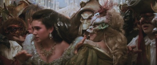 uncanny-archive: Inside the magic ball~ dream scene: the surreal masquerade ballroom dance. Jennifer