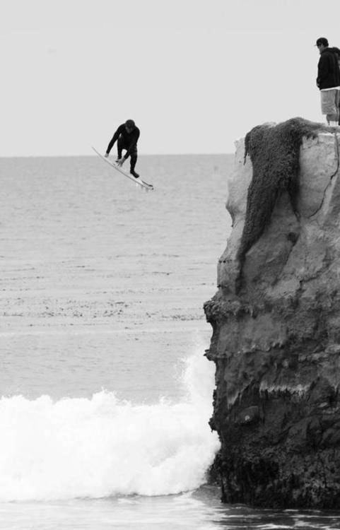joevallinoto:  (via Surfer jumping off cliff into water | Murray Mitchell)