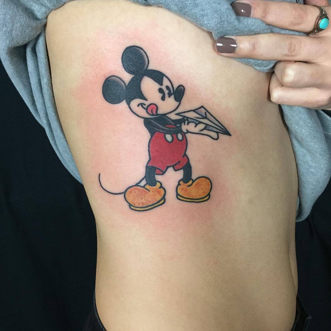 Minimalist Mickey Mouse and Logan tattoo