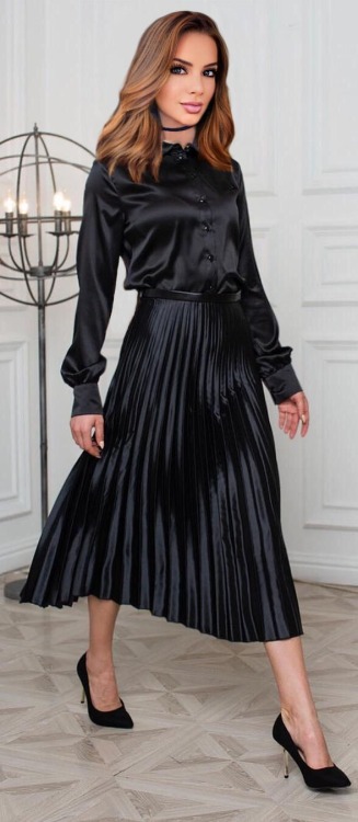 Black midi-skirt with pleats and paired with a matching black blouse - divine!