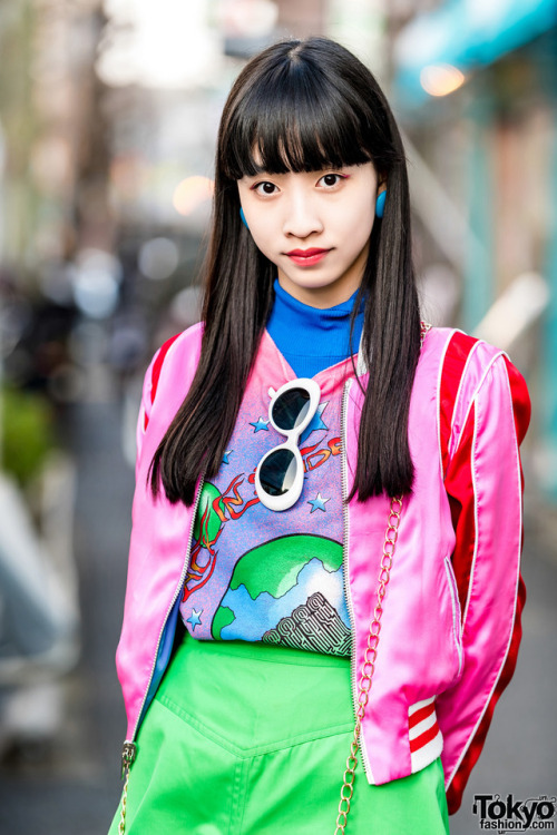 15-year-old Japanese student Yoh on the street in Harajuku wearing a pink satin jacket by The Mighty