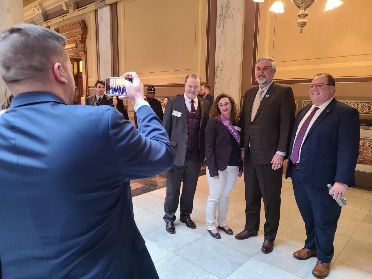 Volunteer advocates, Alzheimer's Association staff, and Governor Eric Holcomb pose for a picture at State Advocacy Day.