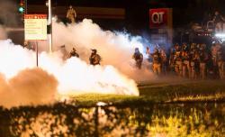 aydenjfoster:  The above image is of a cop mocking the protestors. The day we began to fear the armed men and women who vowed to protect us, was the day our country failed us. This isn’t freedom. This is fear. 