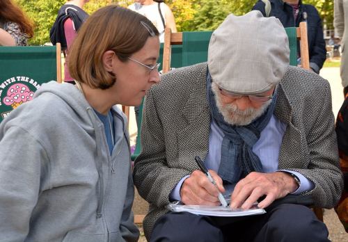 Ms Falk sharing a hearty laugh and happy memories at Clapham Common bandstand, with Mr. David Stuart