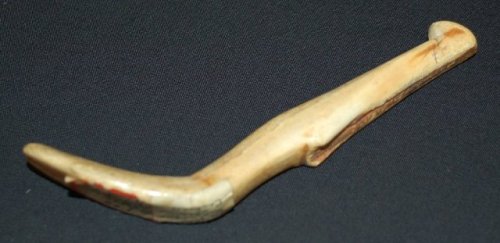 Possiblythe handle of an implement for flaking, carved from walrus ivory(acquired 1954).Thetool is 1