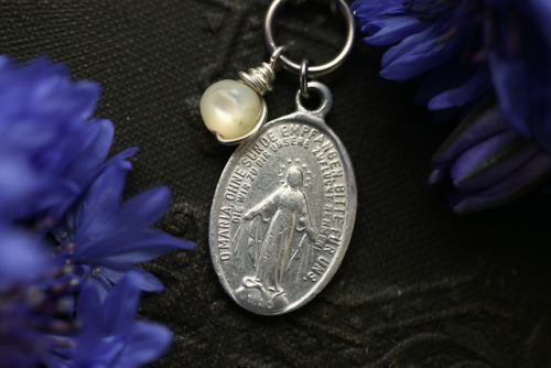 Antique white rosary mother of pearl beads and vintage pilgrim medals made into elegant necklaces.Av