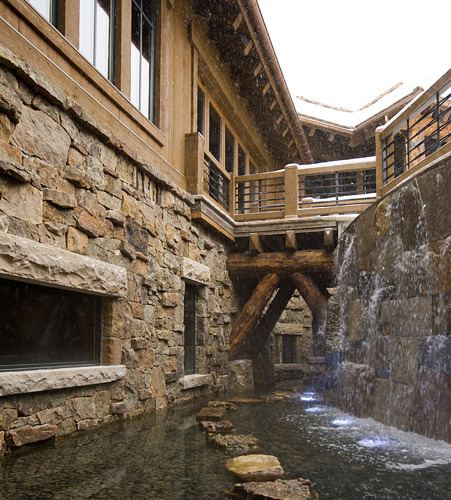 By Billy Beson Company This moat in a Colorado ski house leads to the wine cellar. The waterfall doo