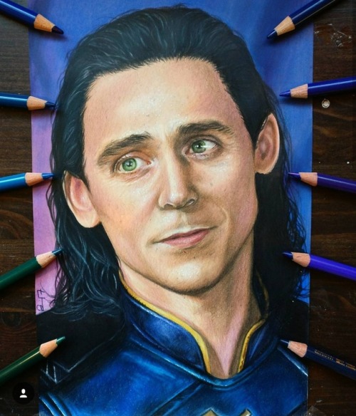 Colored pencils portrait of Loki, from 2017.  Instagram @junitaide