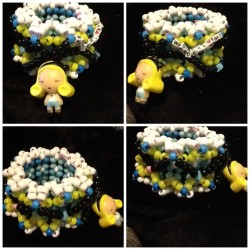 sugarlungs:  Alice In Wonderland kandi cuff(:   omfgggg want so badly. omg. gorgeous.