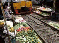 gifsboom:  Train passing through a busy vegetable
