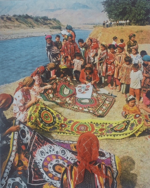 Vintage photo of tajik girls embroidering Suzani, traditional textiles of Central Asia.