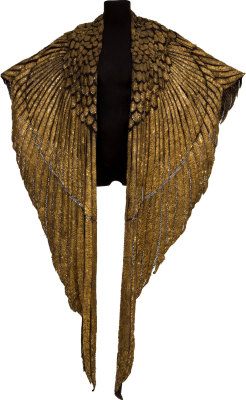 whimsy-cat:“The Elizabeth Taylor Ceremonial Cape from Cleopatra is an ornately designed piece made of thin panels of gold-painted leather adorned with hand-stitched gold bugle beads, seed beads and bead-anchored sequins.” From the 1963 film.