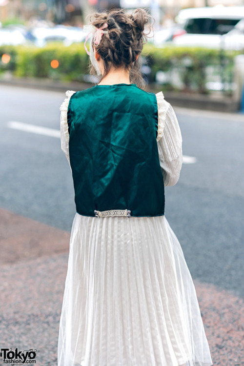 tokyo-fashion:  20-year-old Japanese student Mami on the street in Harajuku wearing a vintage pleated dress under a vintage floral brocade vest, and vintage silver bow-laced shoes. Full Look