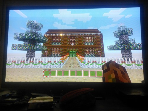 Shitty quality pictures of the Festive Texture pack since I don’t know how to screenshot on the Xbox One. The lollipops and wreaths and the icicles on the roof are paintings! And instead of vines, there’s lights hanging from the trees!