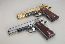 gunrunnerhell:  Duo A pair of custom Colt 1911′s; one in 24K gold and the other in nickel. Both have been worked on by the Seattle Engraving Company. Although the gold one has a “Buy It Now” of ŭ,000, it looks like it will sell for much less considering