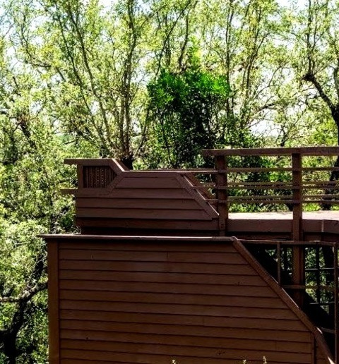 An Enormous Transitional Backyard Deck With No Cover, As An Example