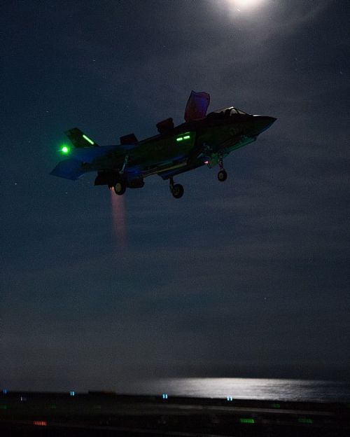 retrowar: An F-35 Lightning II fighter jet conducts the first ever night-time flight trials aboard t