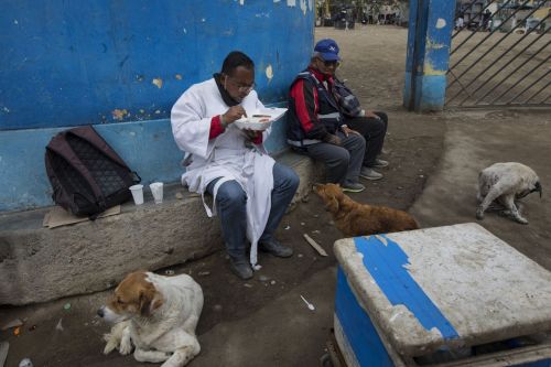 Brother Ronald Marin, originally from Guacara, Venezuela, has lunch between burials, at the “Martire